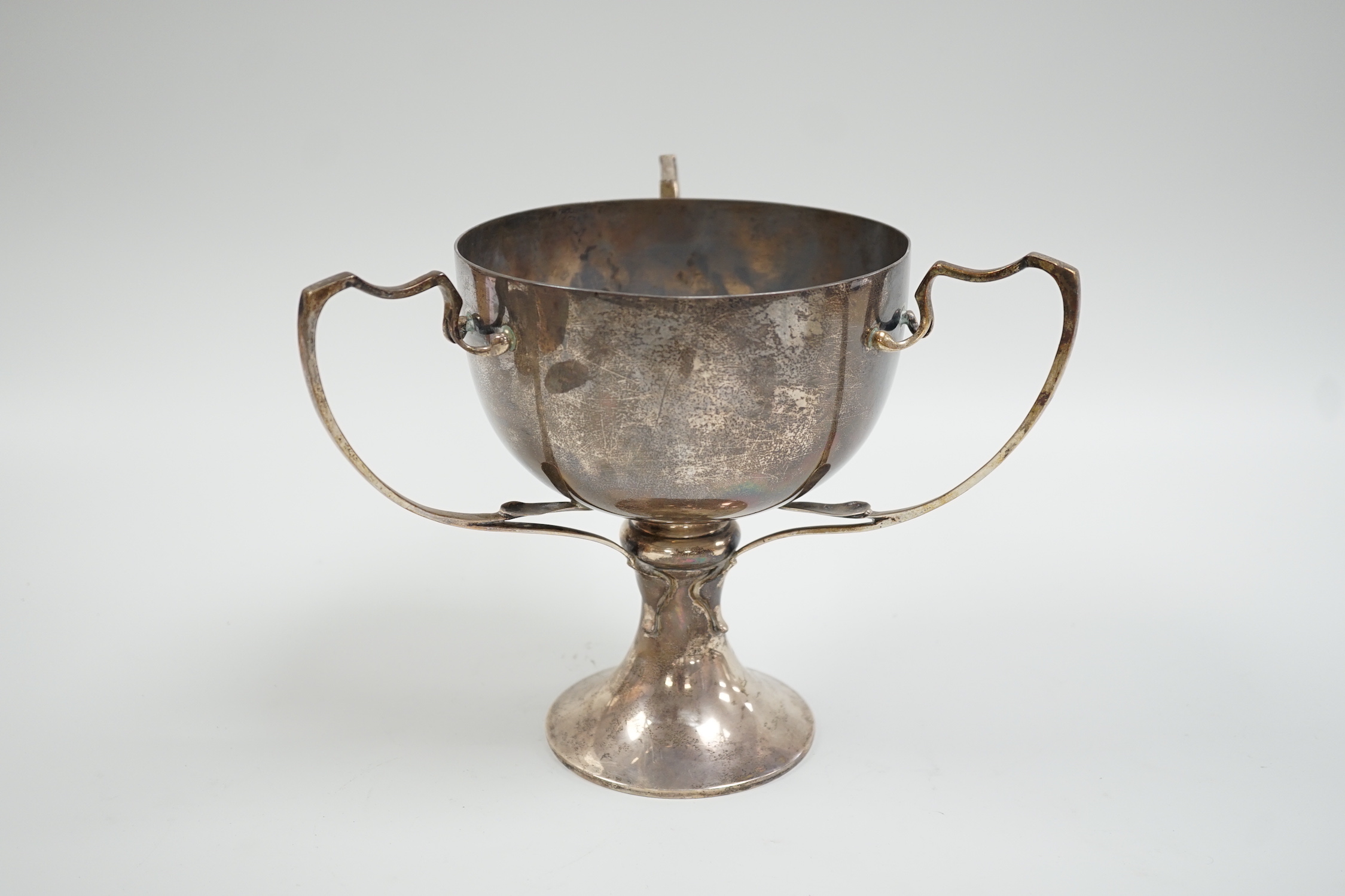 A George V silver tri-handled presentation cup, with engraved inscription, Charles Boyton & Son Ltd, London, 1912, height 19.6cm, 26.5oz.